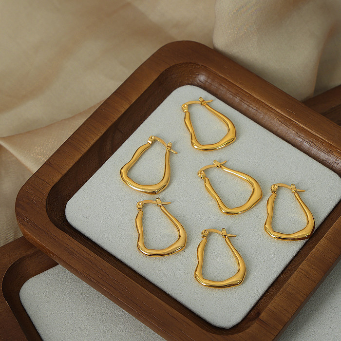 1 par de pendientes chapados en oro de 18 quilates de acero inoxidable con revestimiento geométrico de estilo simple