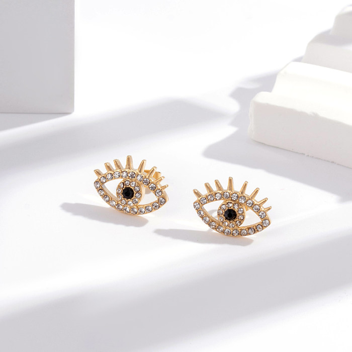 1 par de pendientes colgantes chapados en oro de 18K con incrustaciones de ojo en forma de corazón y borla de estilo Simple de acero inoxidable con circonita