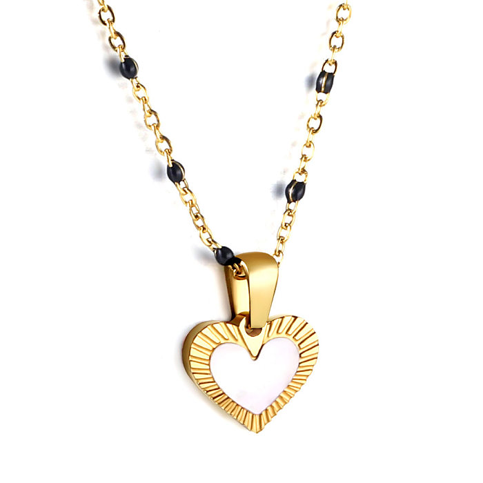 Halskette in Herzform aus Edelstahl im IG-Stil mit Intarsien und Strasssteinen