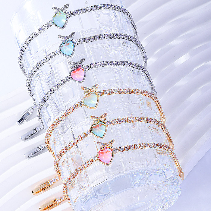 Süße herzförmige Edelstahl-Inlay-Zirkon-Armbänder mit 18-Karat-Vergoldung und versilberten Armbändern