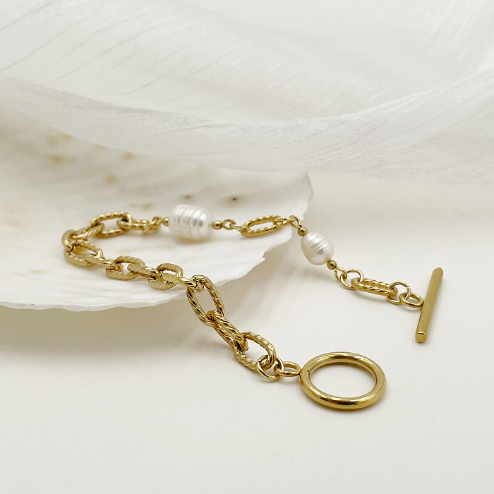 Elegante, einfarbige, vergoldete Armbänder aus Edelstahl mit Knebel- und Perlenbeschichtung im britischen Stil