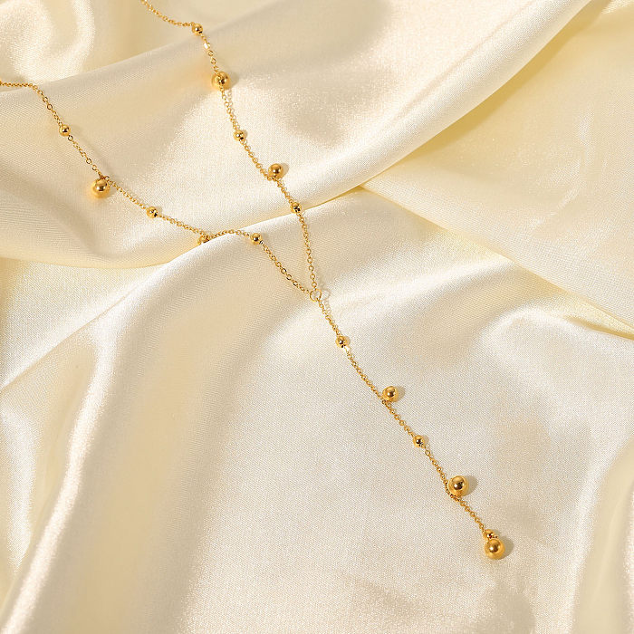 Nouveau Collier avec pompon en perles rondes en acier inoxydable plaqué or 18 carats