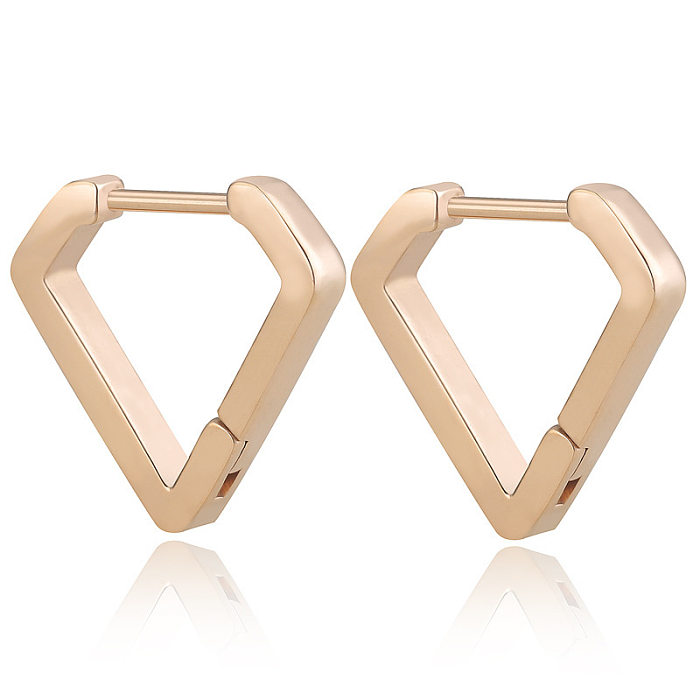 1 paire de boucles d'oreilles géométriques en forme d'étoile et de cœur en acier inoxydable plaqué or 18 carats