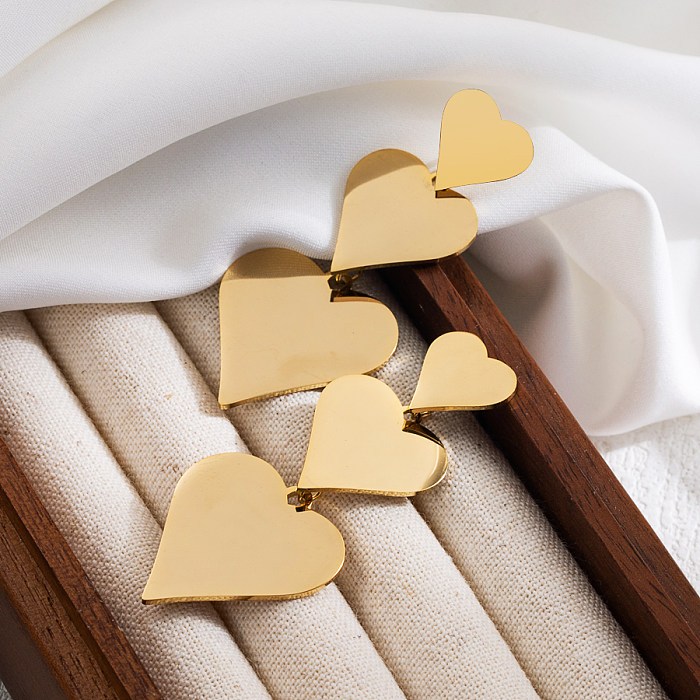 1 par de pendientes colgantes chapados en oro de 18 quilates de acero inoxidable tridimensional con forma de corazón dulce básico estilo IG
