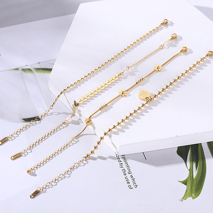 Simple Style Four Leaf Clover Heart Shape Daisy Titanium Steel Inlay Artificial Pearls Bracelets