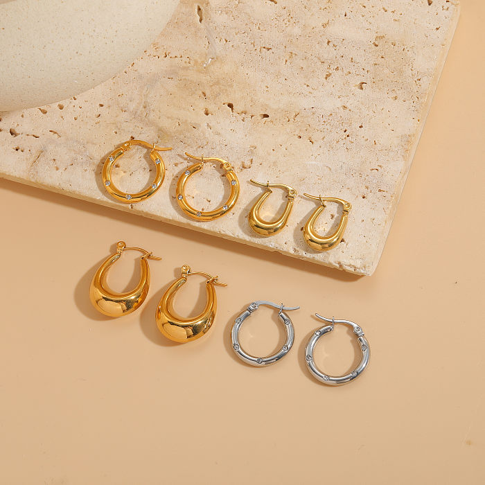 1 Paar elegante C-förmige, U-förmige, asymmetrische, plattierte Inlay-Ohrringe aus Edelstahl mit Zirkon und 14-Karat-Vergoldung