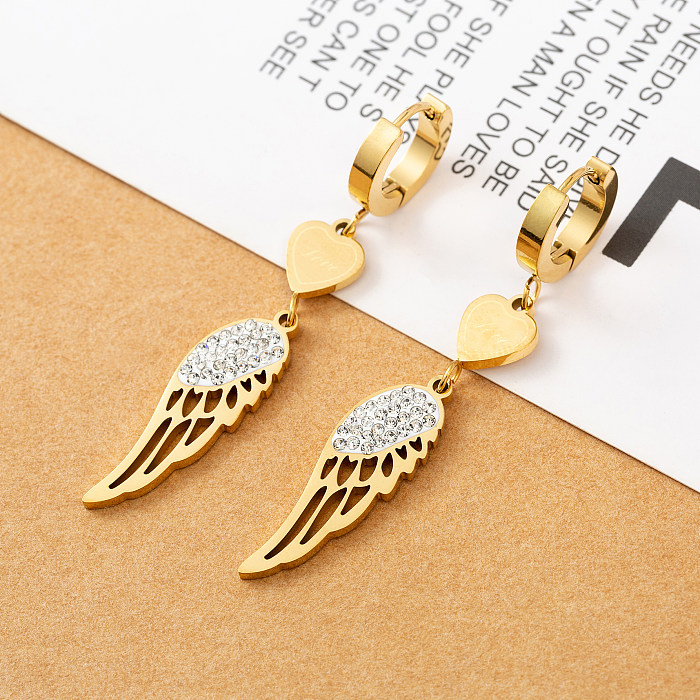 Pendientes colgantes de circonita con incrustaciones chapadas en oro pulido de acero inoxidable con alas circulares a la moda, 1 par