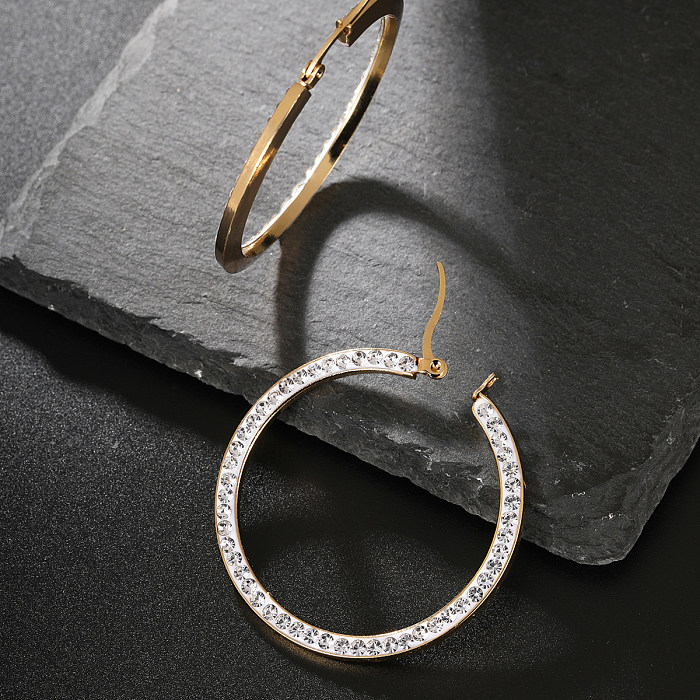 1 par de pendientes de aro elegantes geométricos con incrustaciones de acero inoxidable y diamantes de imitación