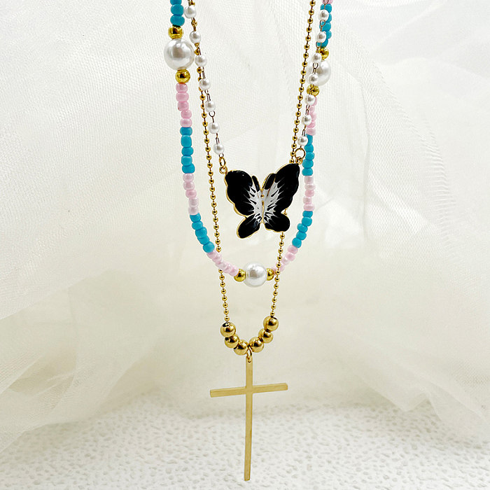 Elegante Halskette mit künstlerischem Kreuz und Schmetterling im Vintage-Stil, Edelstahl, Perlen, Emaille-Beschichtung, vergoldet, dreilagige Halskette