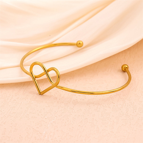 Handgefertigte, einfarbige, herzförmige Knoten-Edelstahl-Manschettenarmbänder mit 18-Karat-Vergoldung in großen Mengen