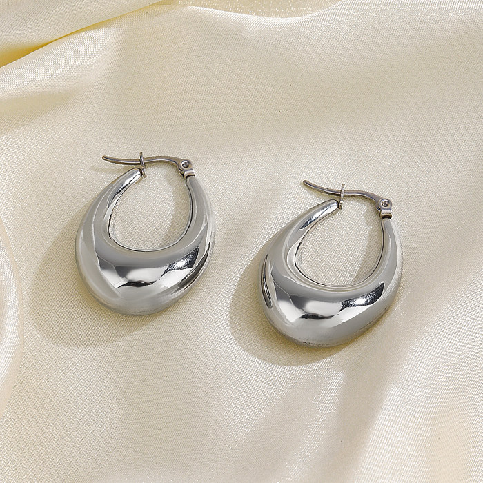 1 paire de boucles d'oreilles ovales en acier inoxydable plaqué or 18 carats, style simple