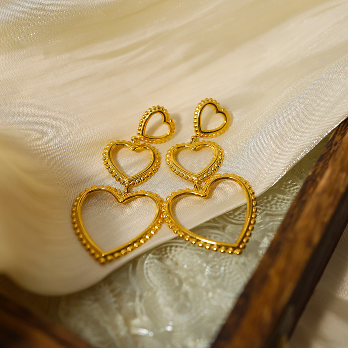 1 par de pendientes colgantes chapados en oro de 18 quilates de acero inoxidable huecos chapados en forma de corazón estilo francés de vacaciones estilo IG