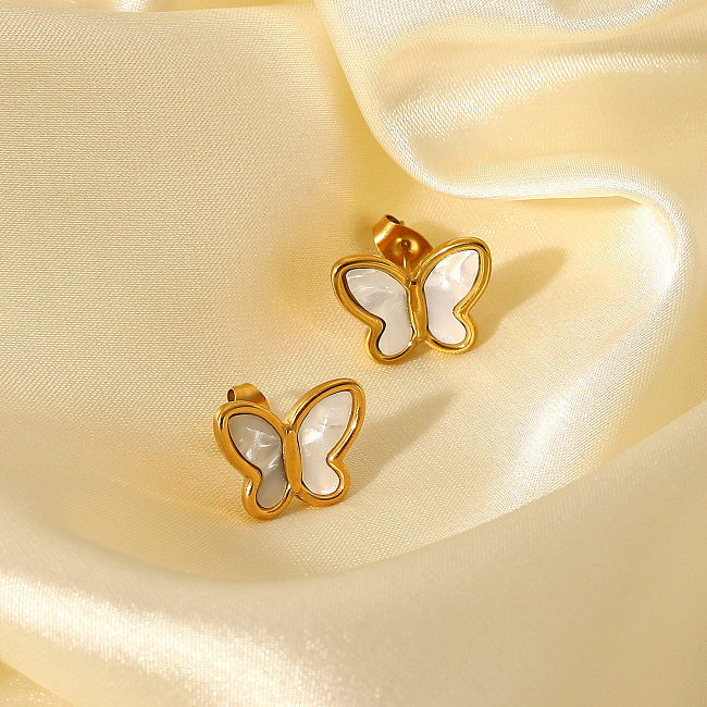 Modischer Ohrstecker aus 18-karätigem Gold mit natürlicher weißer Muschel und Schmetterlingsform aus Edelstahl