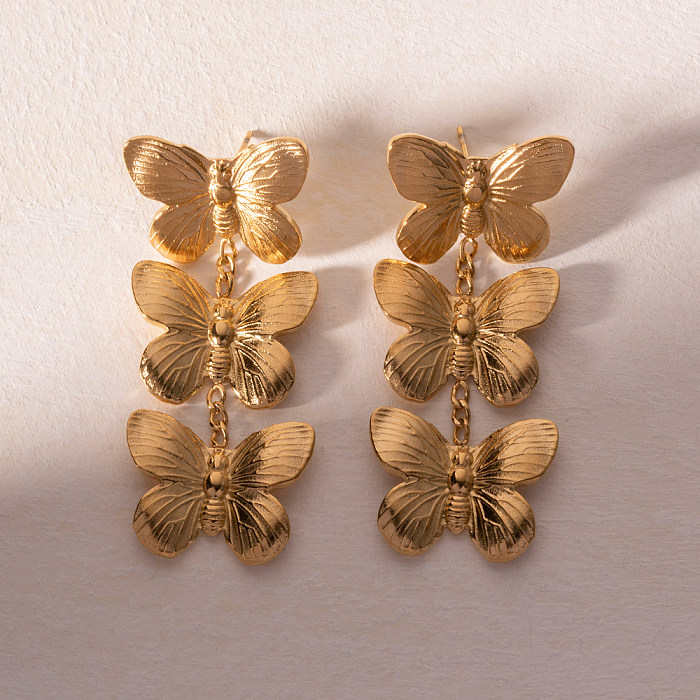 1 par de pendientes colgantes chapados en oro de 18 quilates de acero inoxidable con revestimiento de mariposa estilo IG