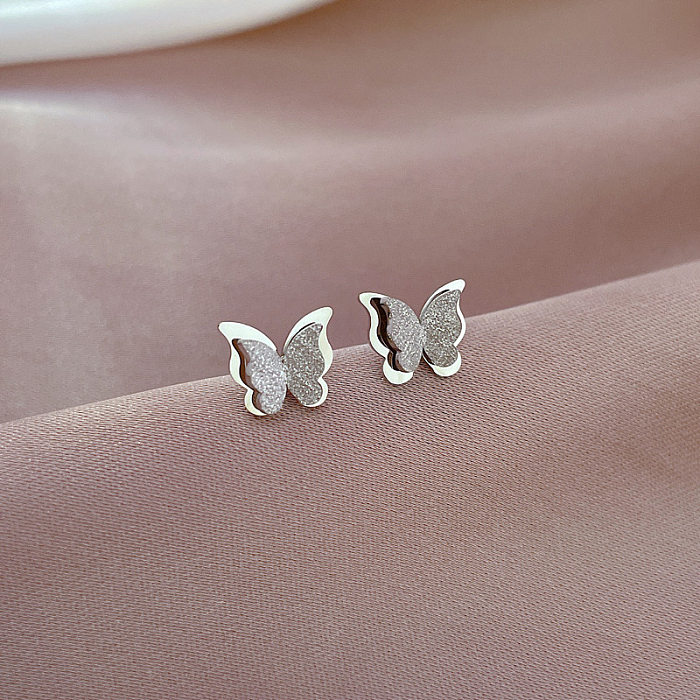 1 paire de clous d'oreilles papillon plaqués en acier inoxydable, Style Simple
