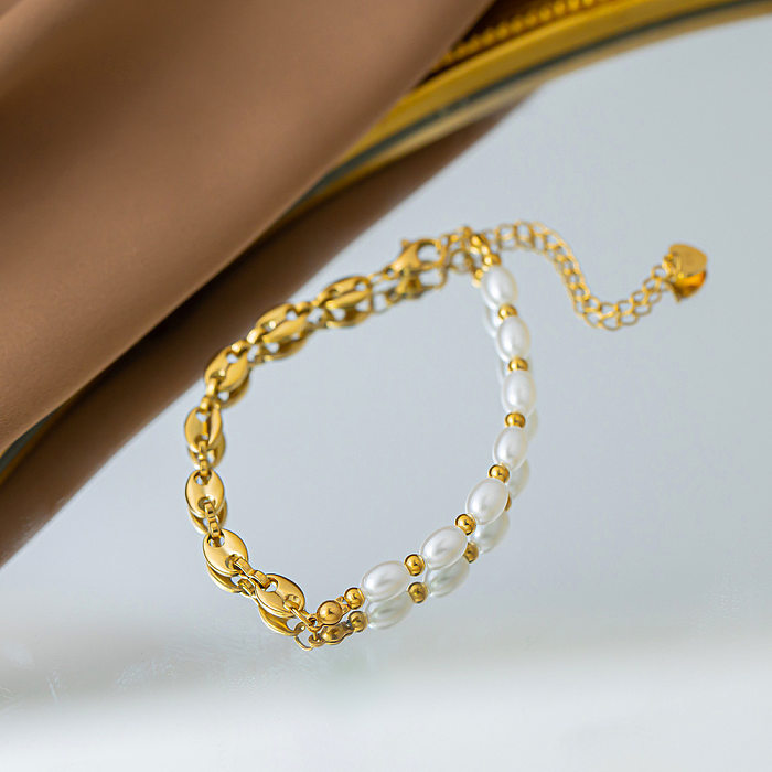 Großhandel mit ovalen Armbändern aus Titanstahl im IG-Stil mit Perlenbeschichtung