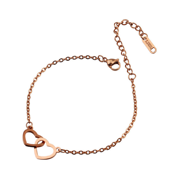 Bracelets plaqués or rose ajourés en acier inoxydable en forme de cœur doux 18 carats