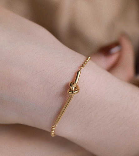Bracelets plaqués or en acier titane avec nœud de style simple en vrac