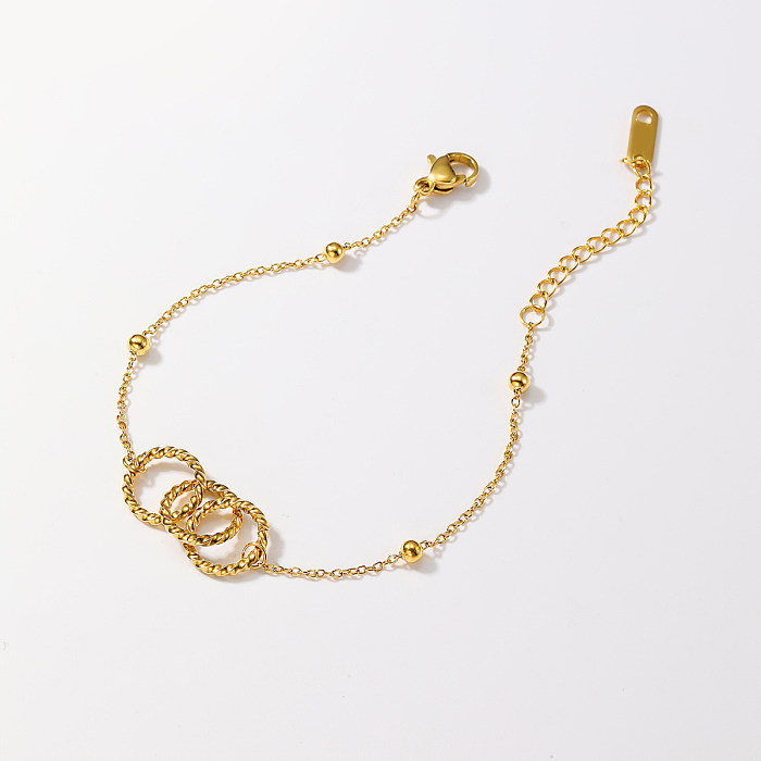 Großhandel mit eleganten Armbändern in runder Herzform aus Edelstahl mit 18-karätigem Goldüberzug und künstlichem Diamant