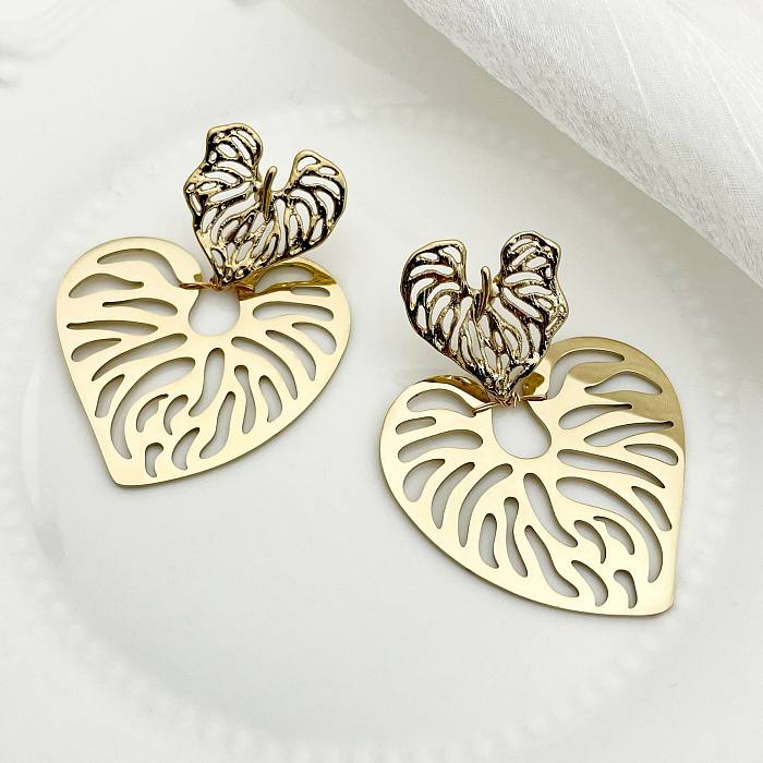 1 paire de boucles d'oreilles plaquées en acier inoxydable, style rétro, streetwear de plage, en forme de cœur