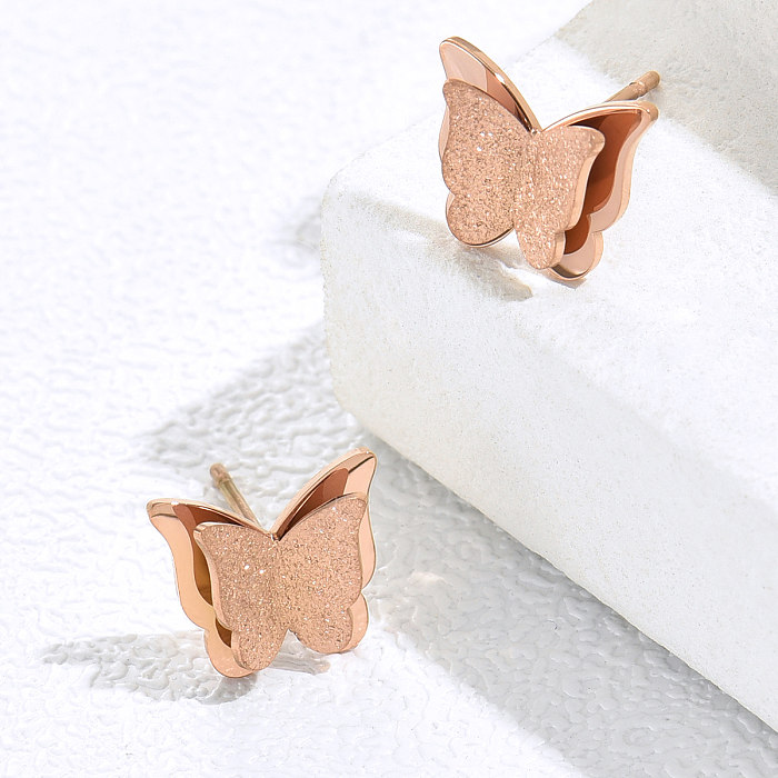 1 paire de clous d'oreilles papillon plaqués en acier inoxydable, Style Simple