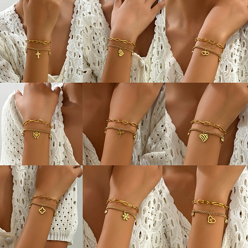 Pulseras de diamantes de imitación chapadas en oro de 18 quilates con incrustaciones de acero inoxidable con cruz de hip-hop casual al por mayor