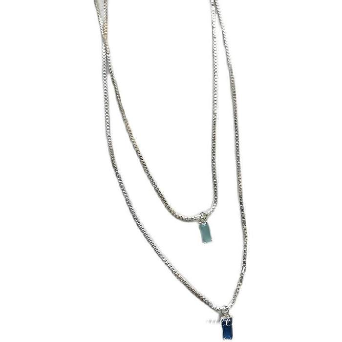 Einfache Halskette mit geometrischem Edelstahlüberzug und Inlay-Zirkon-Anhänger
