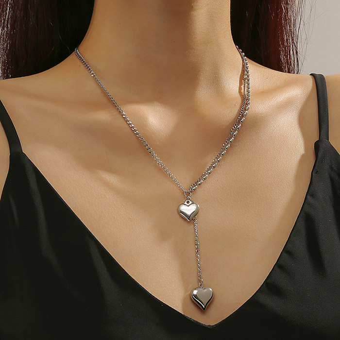 Collier pendentif de polissage en acier inoxydable en forme de cœur de style simple et doux