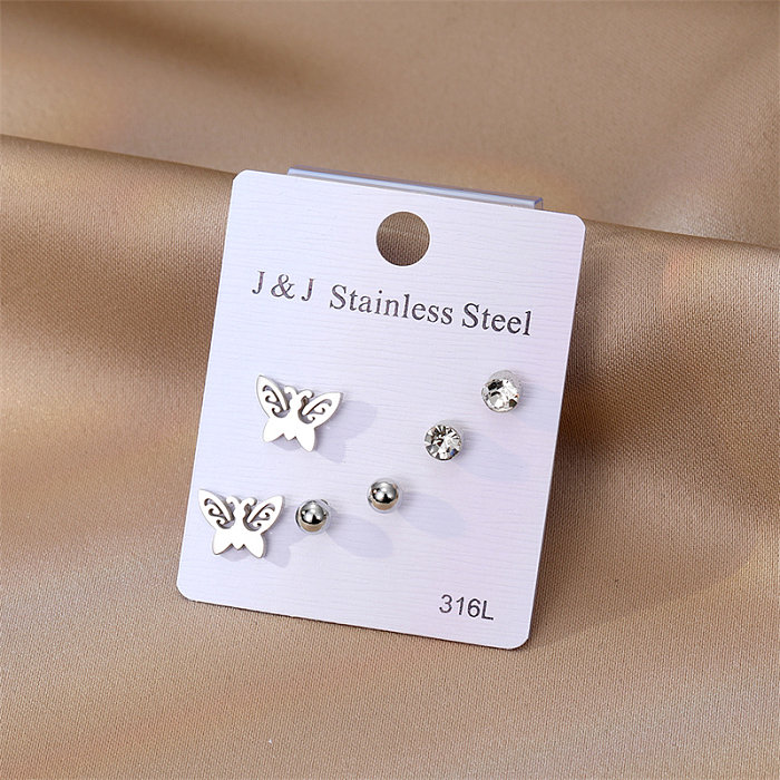 3 pares de elegantes pendientes de mariposa con incrustaciones de acero inoxidable y circonitas