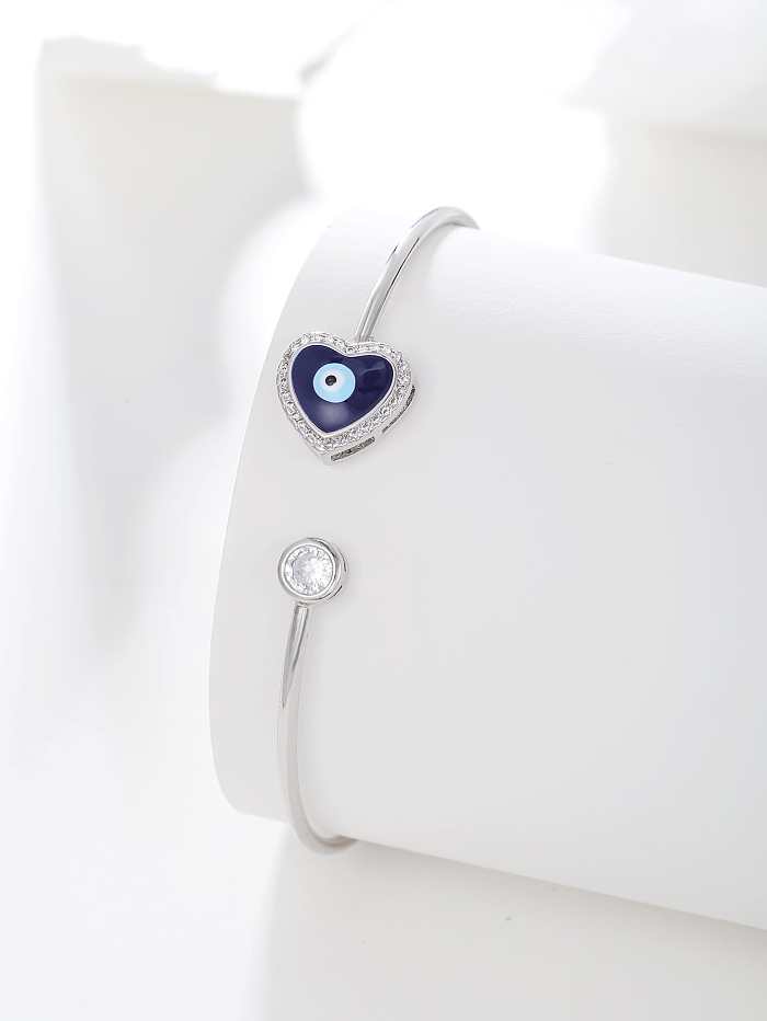 Bracelets de manchette plaqués argent de Zircon d'incrustation de placage d'acier inoxydable d'oeil de forme de coeur de Style Simple