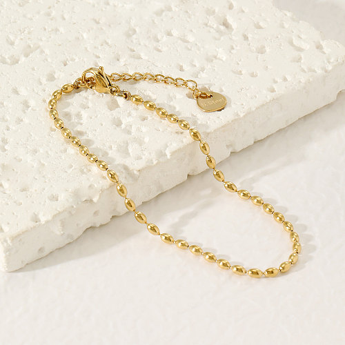 Einfache Pendelarmbänder aus einfarbigem Edelstahl mit Perlenbeschichtung und 14-Karat-Vergoldung
