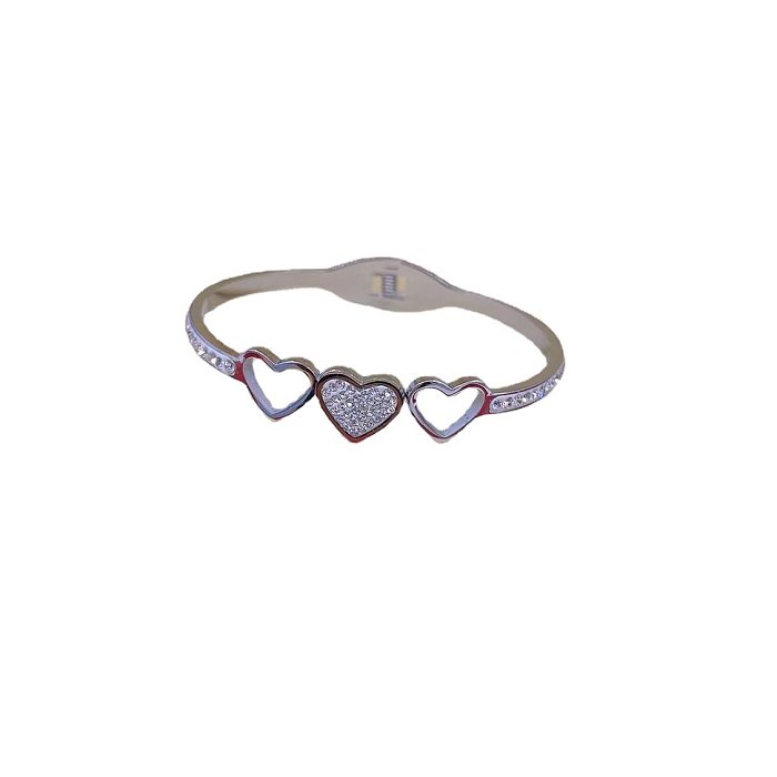 Bracelet en zircon incrusté d'acier inoxydable en forme de coeur de style simple