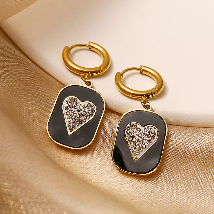1 par de pendientes colgantes chapados en oro de 18 quilates con incrustaciones de acero inoxidable y circonitas brillantes en forma de corazón