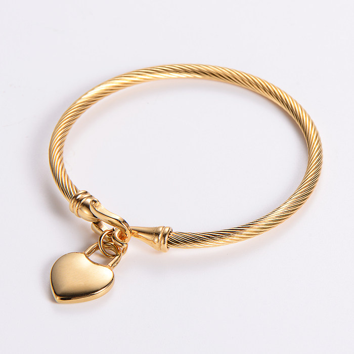 Atacado estilo clássico geométrico formato de coração caveira pulseira banhada a ouro 18K de aço inoxidável