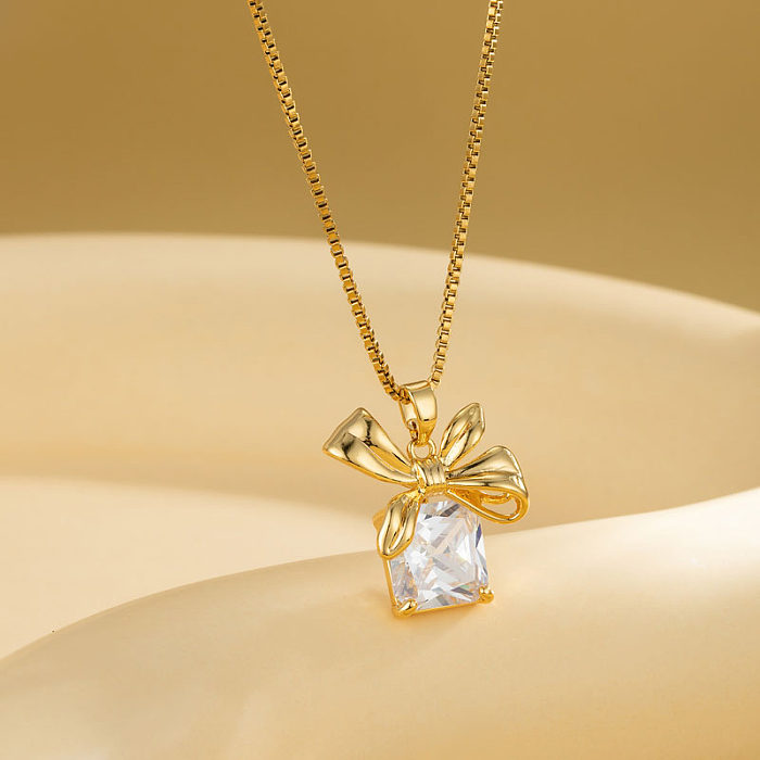 Estilo moderno brilhante forma de coração flor arco nó aço inoxidável chapeamento de aço inoxidável inlay zircão 18k banhado a ouro pingente colar