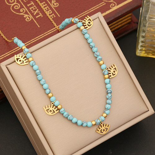 Böhmische Sternauge-Schmetterlings-Halskette mit türkisfarbenem Perlenanhänger aus Edelstahl