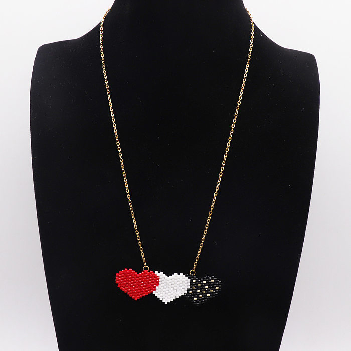 Collier avec pendentif en acier inoxydable en forme de cœur avec lèvres artistiques