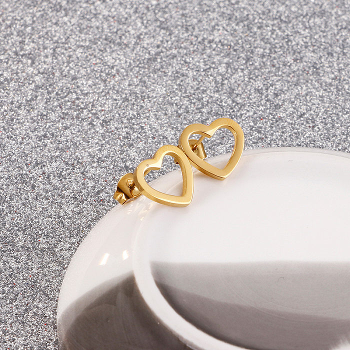 European And American Ladies Fashion Simple Trend Stainless Steel Hollow Heart Stud Earrings Factory In Stock Wholesale