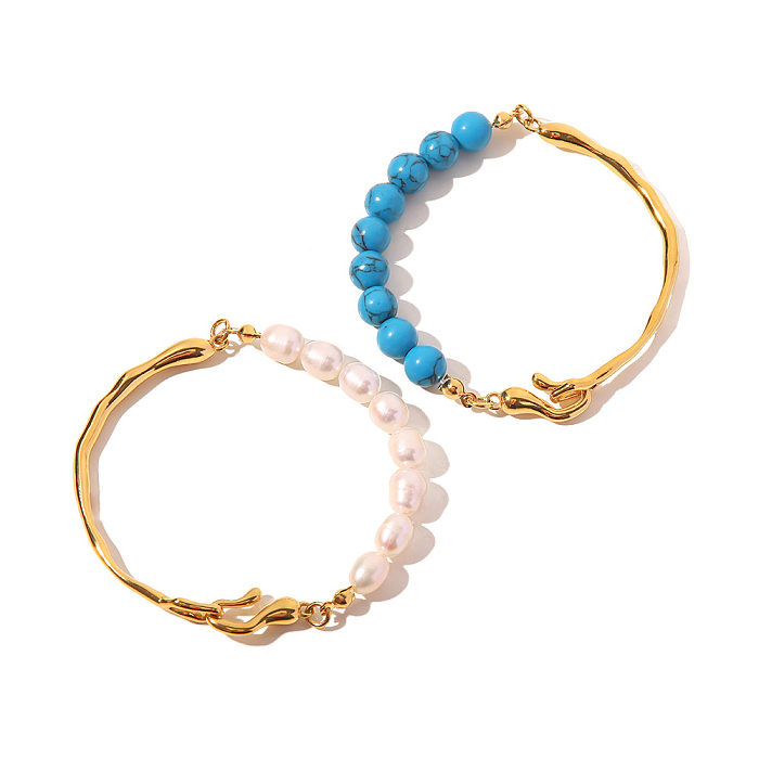 Luxuriöse geometrische Edelstahl-Armbänder mit vergoldeten türkisfarbenen Perlen