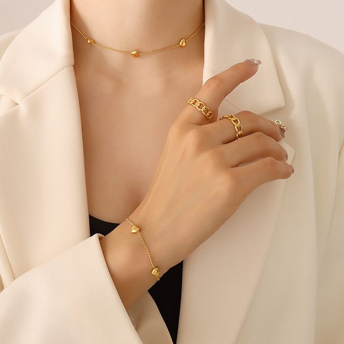 Conjunto de joyería chapado en oro de acero inoxidable, pulsera femenina, collar en forma de corazón de moda