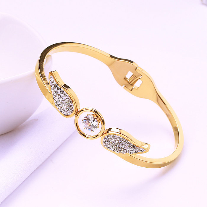Elegante pulseira de zircão com incrustação de aço titânio com asas de anjo