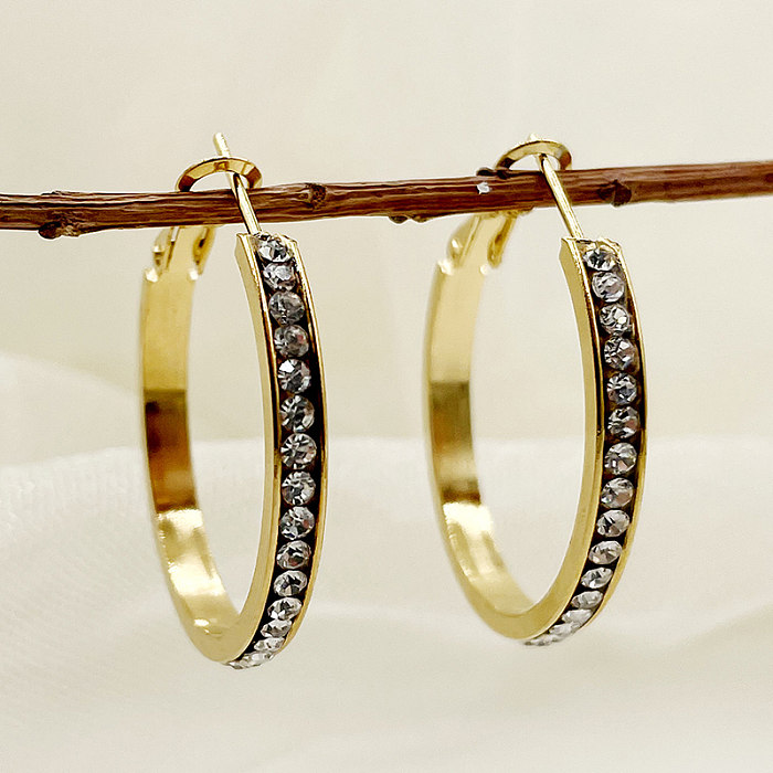 1 par de pendientes de aro chapados en oro con circonitas de acero inoxidable con incrustaciones circulares de estilo sencillo y dulce Rock
