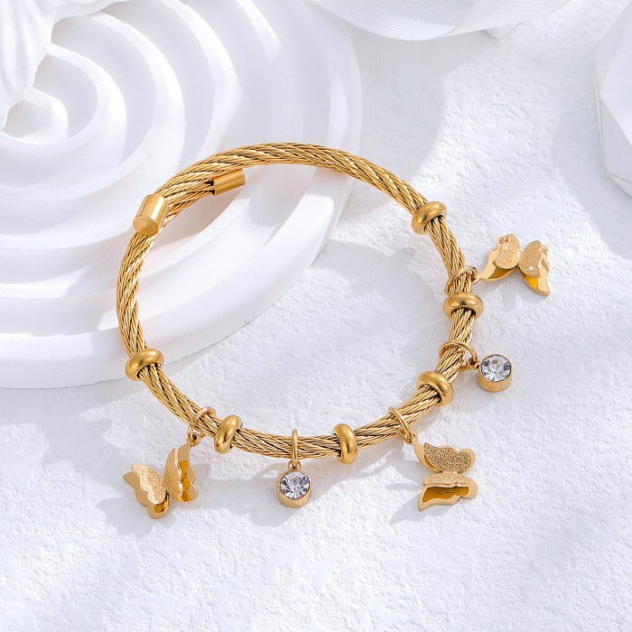 Brazalete de pulseras con diamantes de imitación chapados en oro de 24K de acero titanio y mariposa a rayas de estilo clásico al por mayor