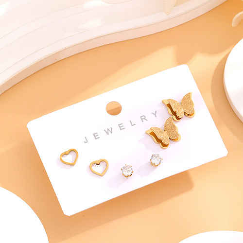 1 Juego de pendientes chapados en oro de 18K con incrustaciones de mariposa en forma de corazón de estilo Simple y elegante, diamantes de imitación de acero inoxidable