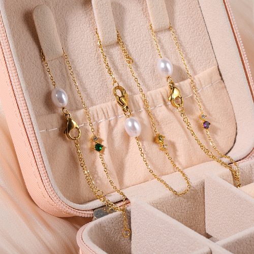 Schlichte, runde Armbänder aus Titanstahl mit Perlenbeschichtung und Zirkoneinlage, 14 Karat vergoldet