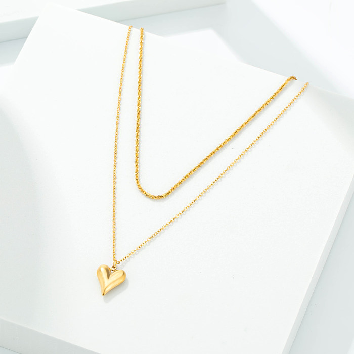 Colgante de collar chapado en oro con incrustaciones de acero inoxidable y mariposa en forma de corazón y estrella informal