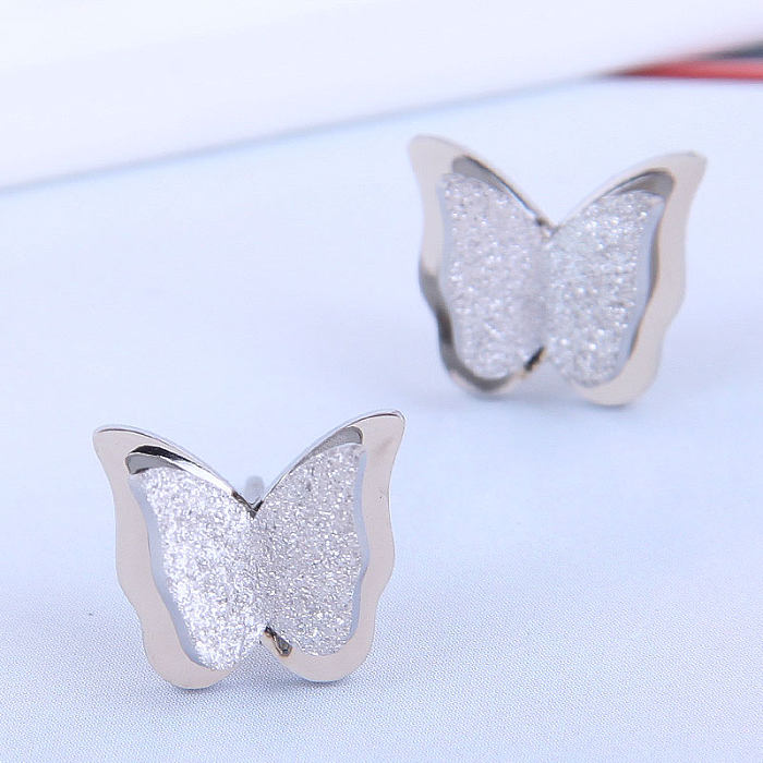 Pendientes de tuerca de acero inoxidable de mariposa de moda coreana, joyería al por mayor