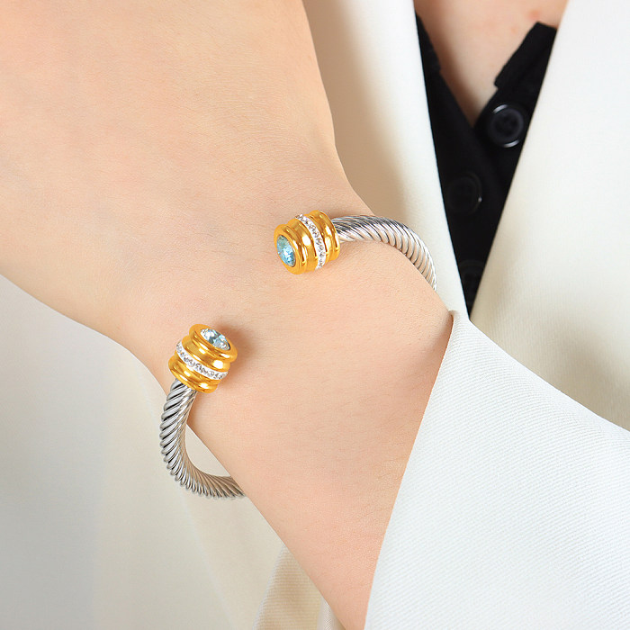 Bracelet plaqué or 18 carats avec incrustation de placage en acier titane rond brillant de style simple