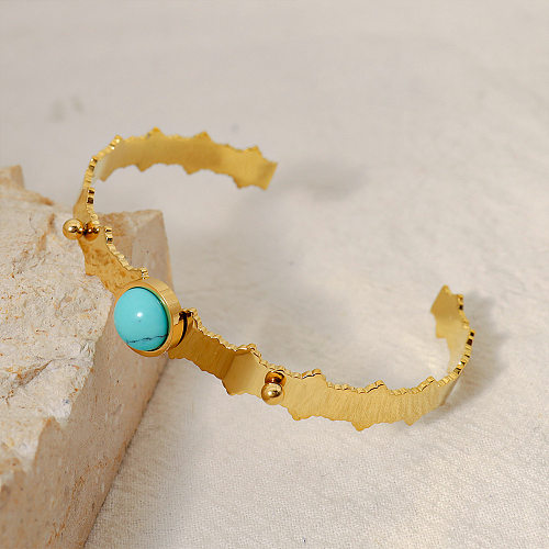 Bracelet turquoise avec incrustation d'acier et de titane rond à la mode