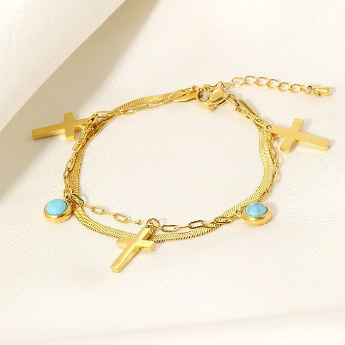 Coole, glänzende, kreuzförmige, runde, geschichtete Edelstahl-Inlay-Armbänder mit türkisfarbener 18-Karat-Vergoldung